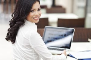 Asian woman at computer-Front Cover